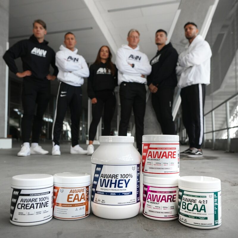 group of people standing on white floor tiles